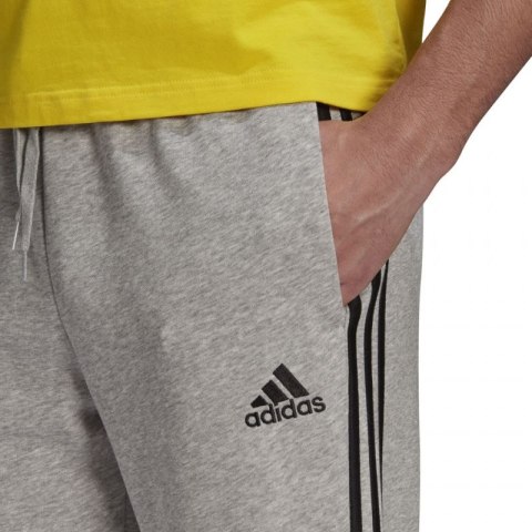 Spodnie adidas Essentials Tapered Cuff 3 Stripes M GK8889 L Spodnie adidas Essentials Tapered Cuff 3 Stripes M GK8889 L